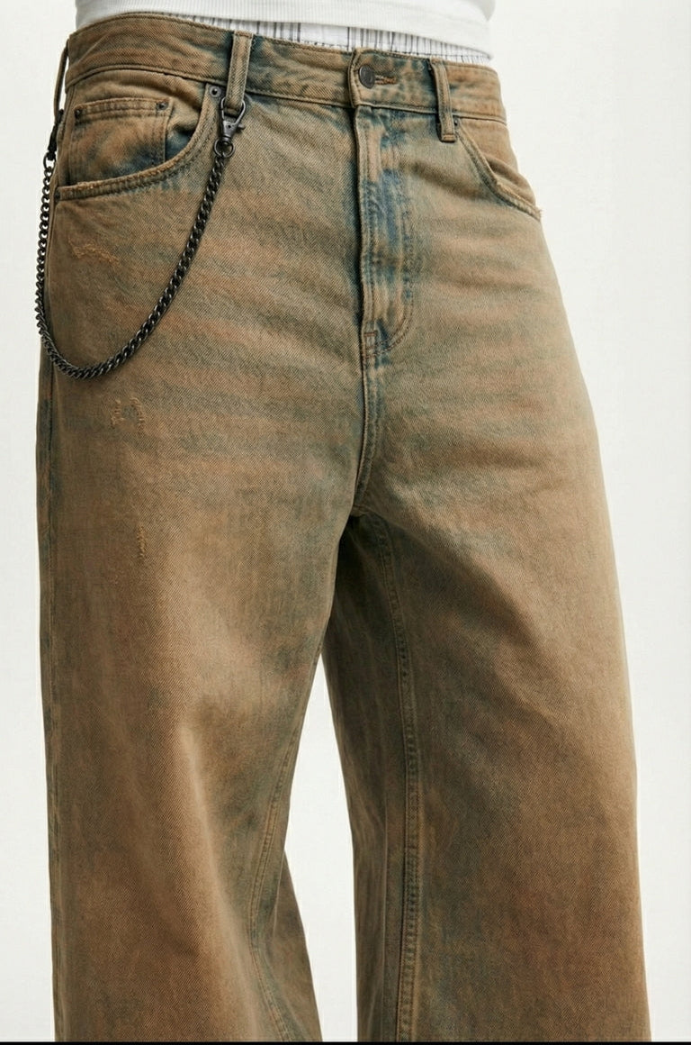 Brown distressed jeans on a white background